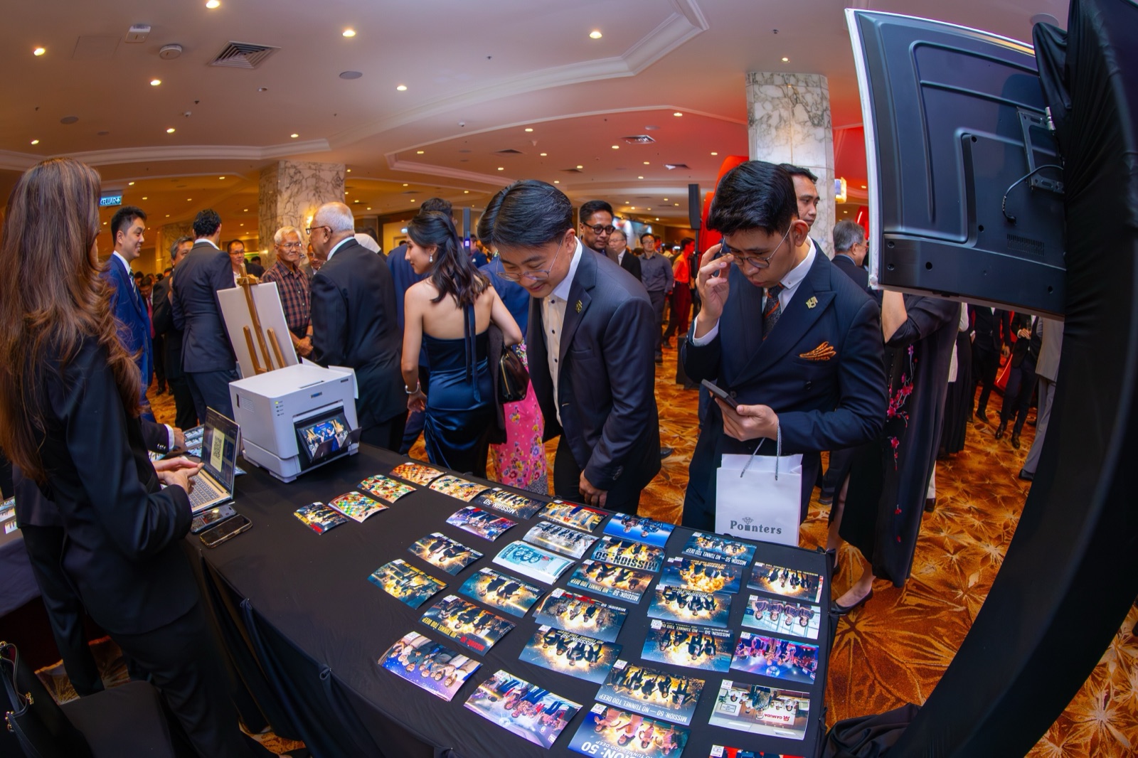 Auragram event booth with guests and branded photo experience